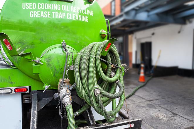 a service truck pumping grease from a restaurant's grease trap in Robesonia